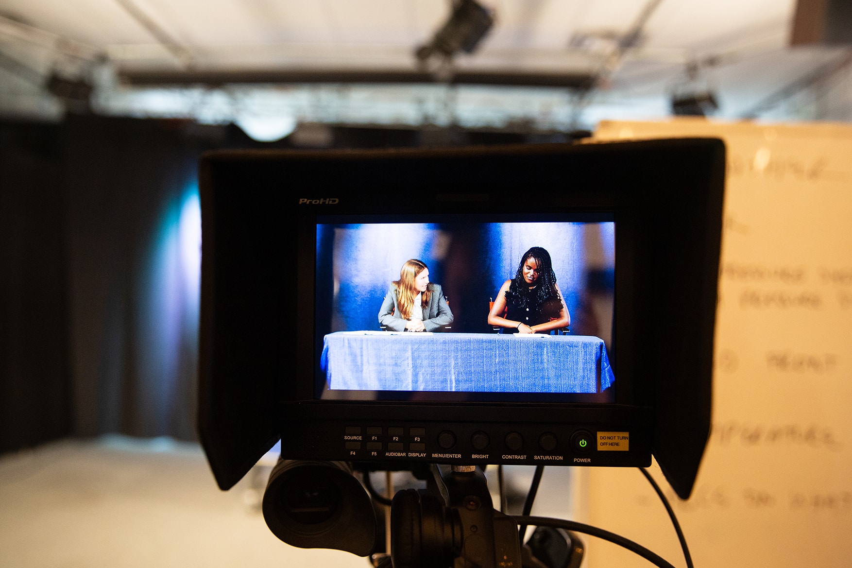 a camera with a screen showing two women